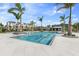 Resort-style pool with ample deck space and palm trees at 7205 Sutton Ln, Sarasota, FL 34240