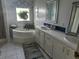 Bathroom features a large garden tub and double vanity at 8512 Fantasia Park Way, Riverview, FL 33578