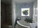 Clean bathroom with a soaking tub and shower at 8512 Fantasia Park Way, Riverview, FL 33578