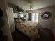Cozy bedroom with a comfortable bed and ceiling fan at 8512 Fantasia Park Way, Riverview, FL 33578