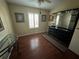Bright bedroom featuring wood flooring and a large dresser at 8512 Fantasia Park Way, Riverview, FL 33578