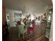 Bright dining room with glass-top table and hardwood floors at 8512 Fantasia Park Way, Riverview, FL 33578