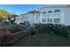 Gray manufactured home with palm trees and walkway at 8512 Fantasia Park Way, Riverview, FL 33578