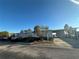 Gray manufactured home with carport and lake view at 8512 Fantasia Park Way, Riverview, FL 33578