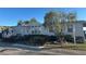 Gray manufactured home with tree and landscaped yard at 8512 Fantasia Park Way, Riverview, FL 33578