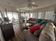 Relaxing Gathering room with comfortable sectional sofa and lake view at 8512 Fantasia Park Way, Riverview, FL 33578