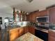 Kitchen boasts granite countertops and ample cabinetry at 8512 Fantasia Park Way, Riverview, FL 33578