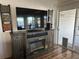 Living room with fireplace and built-in entertainment center at 8512 Fantasia Park Way, Riverview, FL 33578