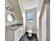 Modern bathroom with granite countertop and shower at 912 E 20Th Ave, Tampa, FL 33605