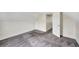 Spacious bedroom with grey carpet and an open door at 912 E 20Th Ave, Tampa, FL 33605