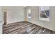 Well lit bedroom featuring wood-look vinyl flooring at 912 E 20Th Ave, Tampa, FL 33605