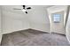 Bright bedroom with grey carpet and a large window at 912 E 20Th Ave, Tampa, FL 33605