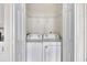 Bright laundry room with washer and dryer in a closet at 912 E 20Th Ave, Tampa, FL 33605