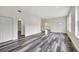 Spacious living area with wood-look vinyl flooring at 912 E 20Th Ave, Tampa, FL 33605