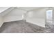 Upper floor hallway with grey carpet and access to bedrooms at 912 E 20Th Ave, Tampa, FL 33605