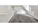 Upper floor hallway with grey carpet and access to bedrooms and bathroom at 912 E 20Th Ave, Tampa, FL 33605
