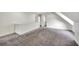 Upper floor hallway with grey carpet and access to bedrooms and bathroom at 912 E 20Th Ave, Tampa, FL 33605