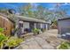 Backyard with a patio, basketball hoop and lots of plants at 915 E 20Th Ave, Tampa, FL 33605