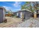 Backyard view of gray house with gravel and shed at 915 E 20Th Ave, Tampa, FL 33605
