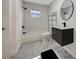 Modern bathroom with white subway tile and gray floor at 915 E 20Th Ave, Tampa, FL 33605