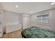 Well-lit bedroom with a dresser and a double bed at 915 E 20Th Ave, Tampa, FL 33605