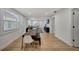 Open concept dining area with rustic wood table and modern chairs at 915 E 20Th Ave, Tampa, FL 33605