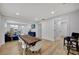 Open concept dining area with rustic wood table and modern chairs at 915 E 20Th Ave, Tampa, FL 33605