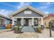 Gray house with white trim, front porch, and landscaped yard at 915 E 20Th Ave, Tampa, FL 33605