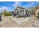 Charming bungalow with a gray exterior and a well-maintained yard at 915 E 20Th Ave, Tampa, FL 33605