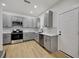 Modern kitchen with gray cabinets and stainless steel appliances at 915 E 20Th Ave, Tampa, FL 33605