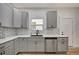 Modern kitchen with gray cabinets and stainless steel appliances at 915 E 20Th Ave, Tampa, FL 33605