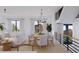 Open concept dining area with light wood table and chairs at 96 Shore Dr, Tarpon Springs, FL 34689