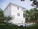 Rear view of two-story home with pool and patio at 96 Shore Dr, Tarpon Springs, FL 34689