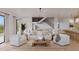 Bright living room with white couches and modern decor at 96 Shore Dr, Tarpon Springs, FL 34689