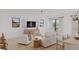 Living Room with white couches and access to balcony at 96 Shore Dr, Tarpon Springs, FL 34689