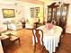 Formal dining room with wood floors and a large wooden hutch at 9790 66Th N St # 248, Pinellas Park, FL 33782