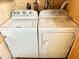 Laundry room with side-by-side Whirlpool washer and dryer at 9790 66Th N St # 248, Pinellas Park, FL 33782