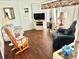Relaxing living room with comfy seating and wood-look flooring at 9790 66Th N St # 248, Pinellas Park, FL 33782
