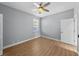 Spacious bedroom with ceiling fan and wood floors at 10038 Reagan Dairy Trl, Bradenton, FL 34212