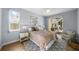 Spacious bedroom with wood floors and access to a private patio at 10038 Reagan Dairy Trl, Bradenton, FL 34212