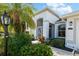 Front entrance of the home with lush landscaping and walkway at 10038 Reagan Dairy Trl, Bradenton, FL 34212