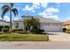 Single-story home with a two-car garage and lush landscaping at 10038 Reagan Dairy Trl, Bradenton, FL 34212