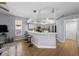 Modern kitchen with light wood cabinets and stainless steel appliances at 10038 Reagan Dairy Trl, Bradenton, FL 34212