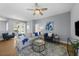 Relaxing living room with a neutral color palette and plenty of natural light at 10038 Reagan Dairy Trl, Bradenton, FL 34212