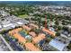 Aerial view showcasing building location, pool, and tennis court at 10764 70Th Ave # 1303, Seminole, FL 33772