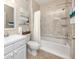 Bathroom with tub, shower, and white vanity at 10764 70Th Ave # 1303, Seminole, FL 33772