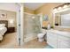 Bathroom with shower, toilet, and white vanity at 10764 70Th Ave # 1303, Seminole, FL 33772