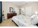 Bedroom with a dresser, TV, and a bed with a nautical-themed comforter at 10764 70Th Ave # 1303, Seminole, FL 33772