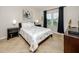 Guest bedroom with a double bed and window at 10764 70Th Ave # 1303, Seminole, FL 33772