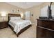 Main bedroom with a king-size bed and window at 10764 70Th Ave # 1303, Seminole, FL 33772